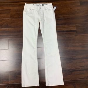 White bootcut jeans w/ silver back pocket buttons
